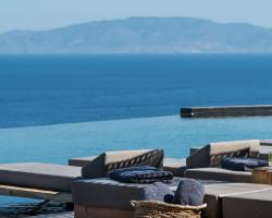 Andronis Arcadia Ocean View Lounging at Infinity Pool